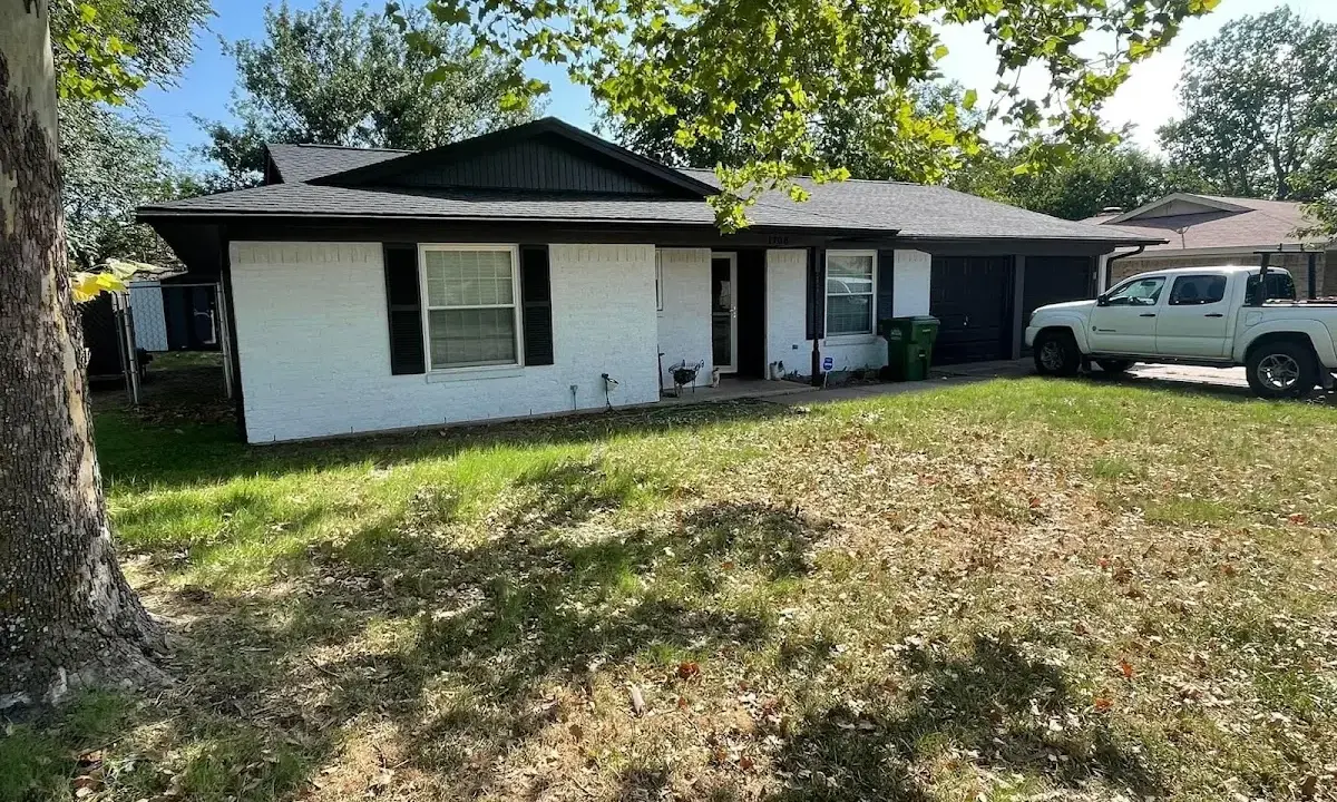 Professional roofing crew working on a residential roof in Kimberly